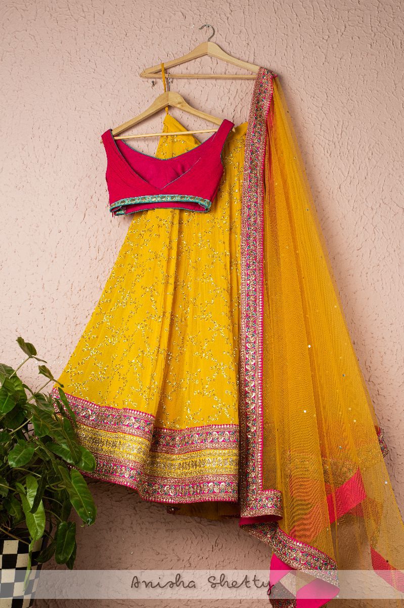 MARIGOLD YELLOW LEHENGA WITH HOT PINK PLEATED BLOUSE AND MARIGOLD YELLOW DUPATTA