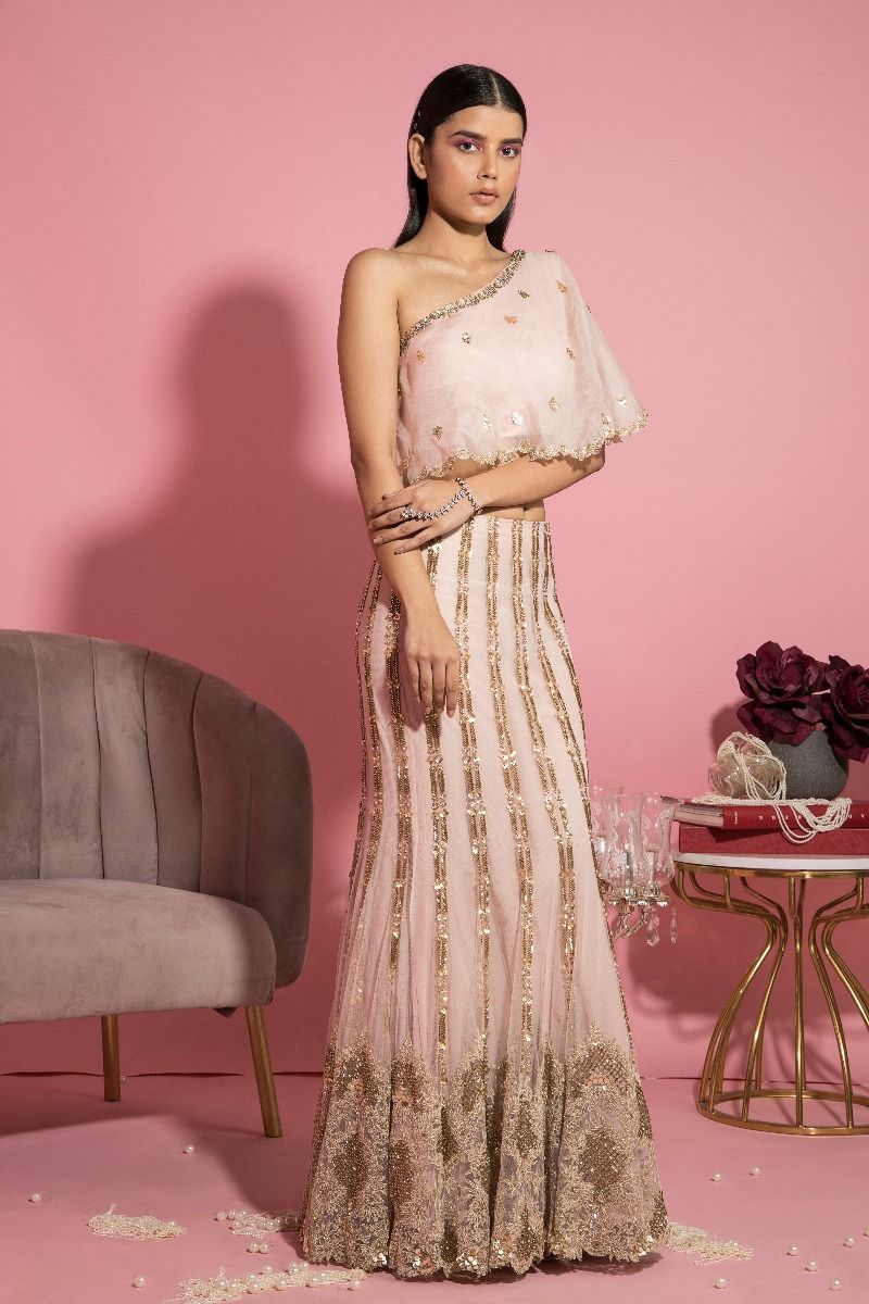 NUDE PINK MERMAID LEHENGA AND ONE SHOULDER CAPE TOP